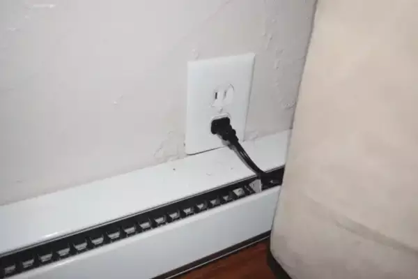 Outlet Above Baseboard Heater