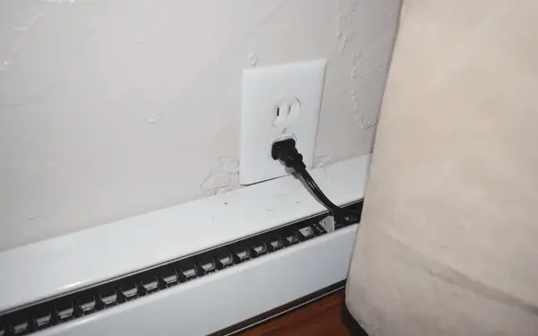 Outlet Above Baseboard Heater